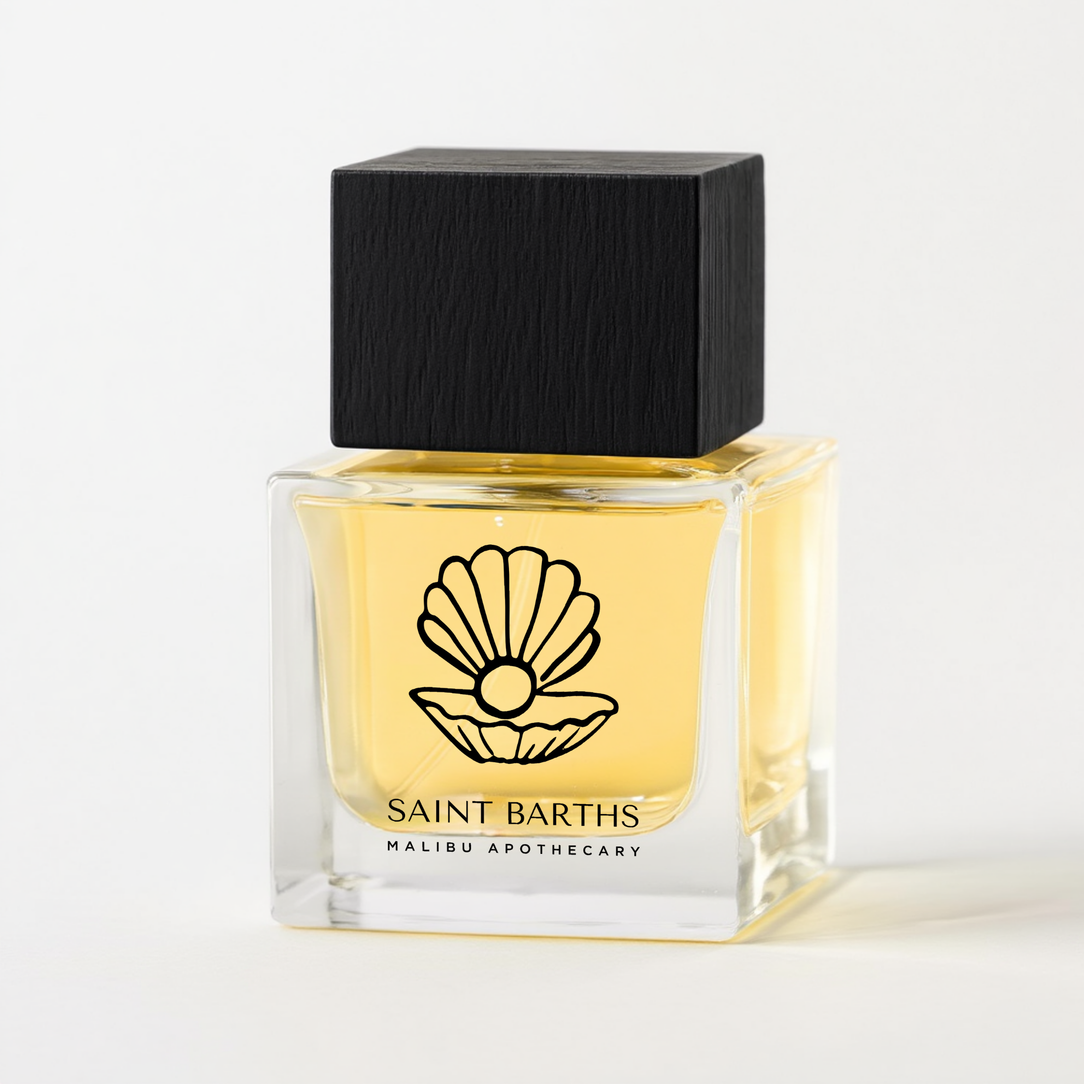 Square glass perfume bottle of Malibu Apothecary Saint Barths with yellow liquid, black square cap, and shell logo on a white background; luxury clean nontoxic custom perfume
