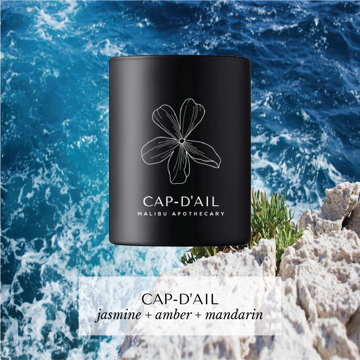 Cap d'Ail votive candle with floral logo and jasmine-amber-mandarin scent, set against rocky cliff and blue ocean, crafted with coconut and soy wax.