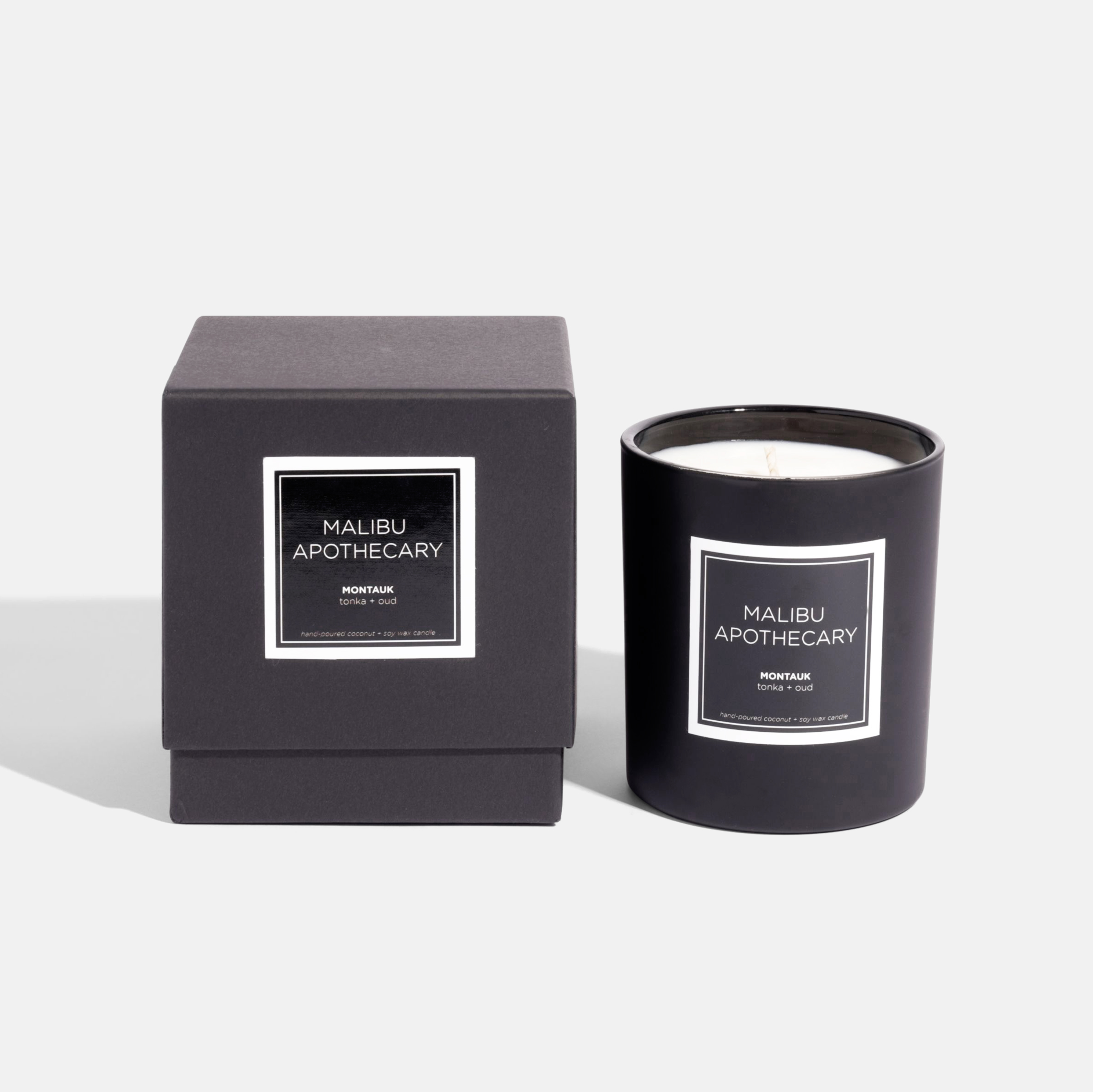 Matte black Malibu Apothecary candle with matching gift box, filled with all natural coconut and soy wax, showcased against white background