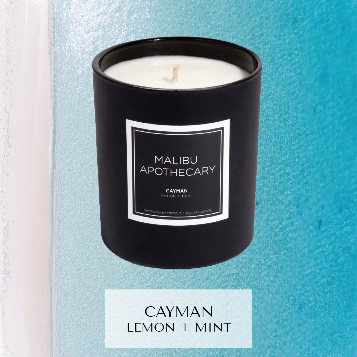 Matte black Malibu Apothecary candle labeled Cayman lemon + mint on a textured turquoise and white background evoking Caribbean waters, made with all natural coconut and soy wax