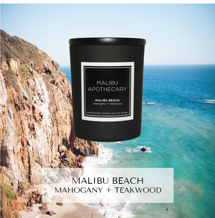 Mini matte black Malibu Apothecary candle labeled Malibu Beach mahogany + teakwood set against an aerial cliffside beach with turquoise ocean background, highlighting mahogany and teakwood notes, made with all natural coconut and soy wax