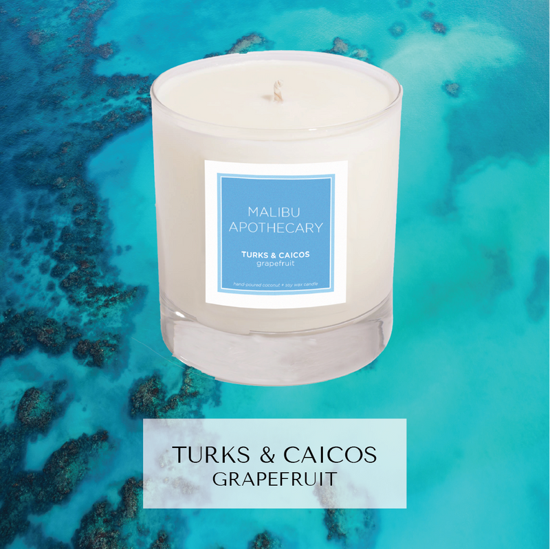 Turks & Caicos islands inspired candle with notes of grapefruit in front of beach