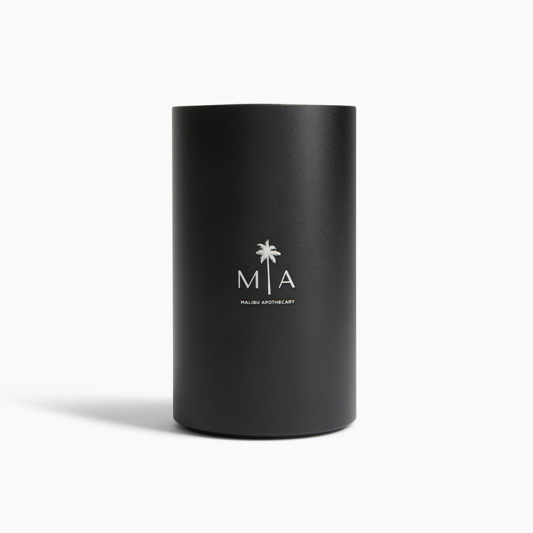 ScentSolution Mini portable scent diffuser by Malibu Apothecary in sleek matte black cylinder with white MIA logo; uses advanced nebulization technology for pure aroma oils.