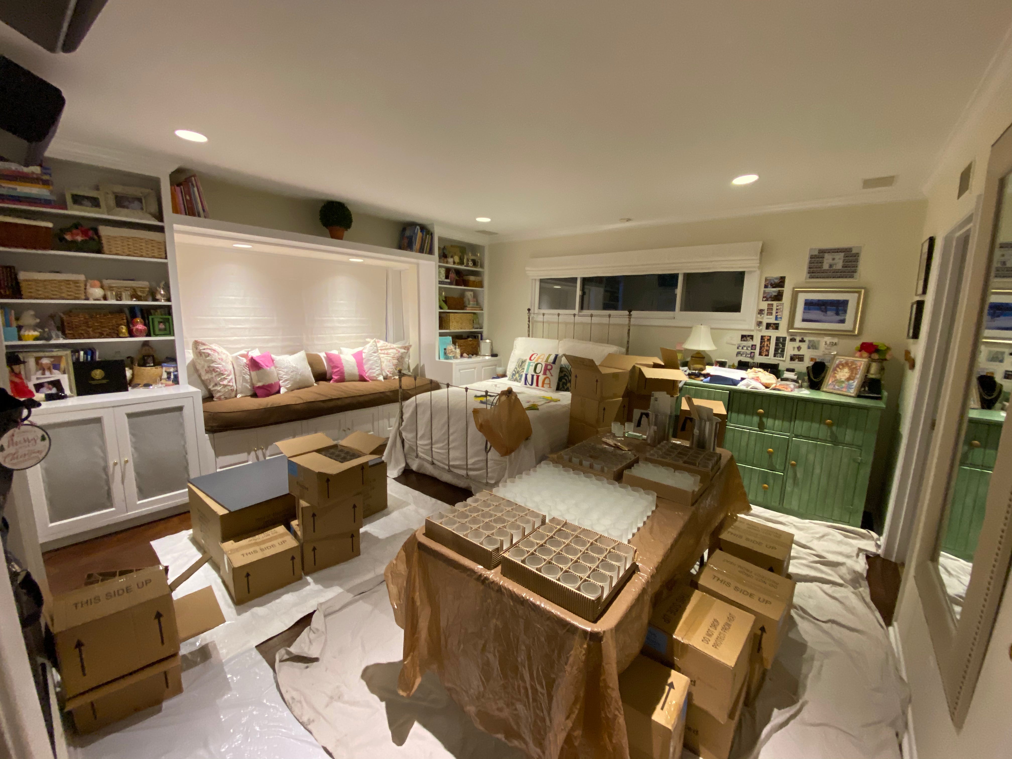 Living room with furniture and boxes indicating recent move-in or renovation.