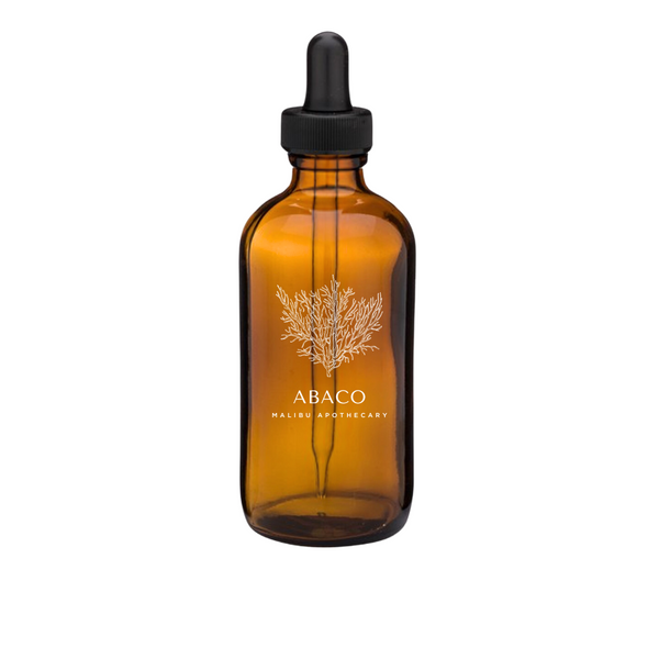 Pure Aroma Oil - Amber glass bottle with dropper labeled 'ABACO' with notes of red currant, abaco pine, geranium