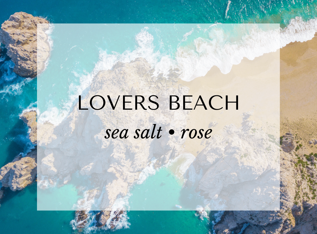 Lovers Beach fragrance card with ocean aerial view. A refreshing coastal-inspired scent featuring ozone, linen, and green leaves top notes; eucalyptus, sea salt, and rose heart notes; and a soft base of moss, powder, and peppercorn.